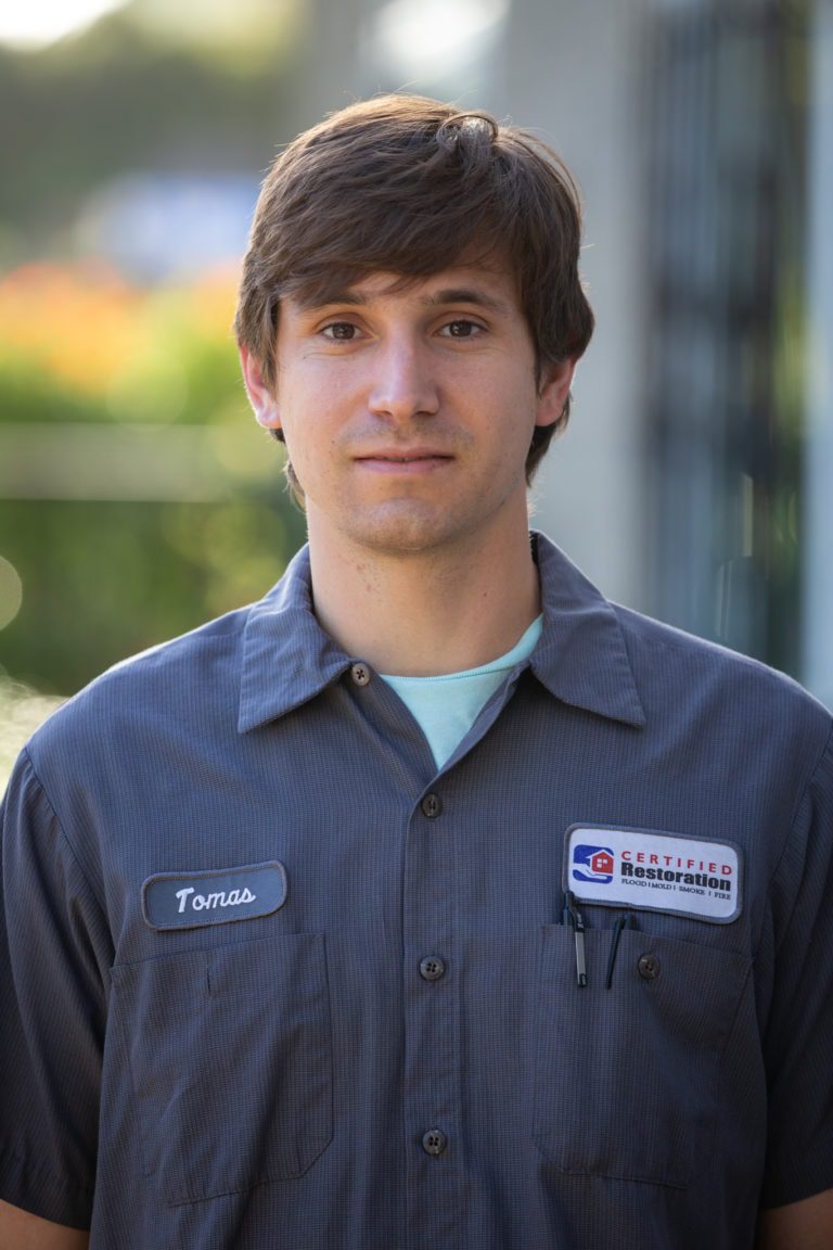 Certified Restoration Inc.'s water damage restoration technician, Tomas