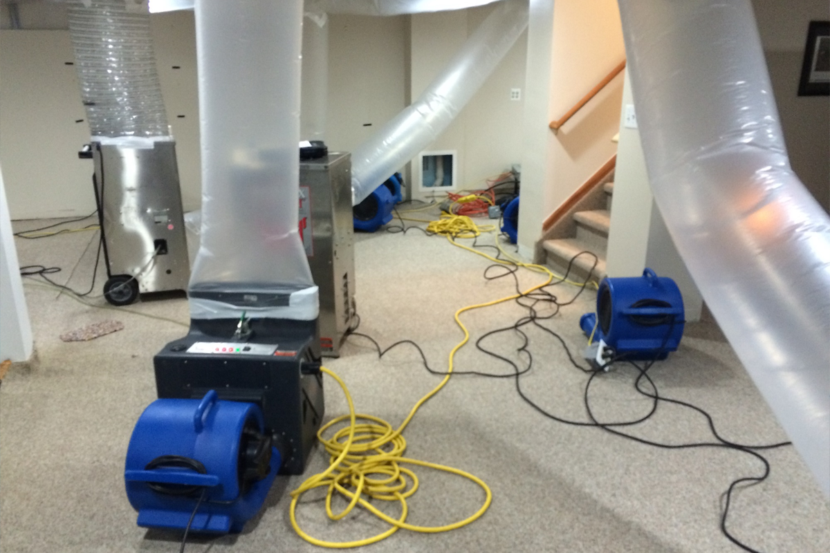a room with several air ducts and a machine